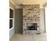 Outdoor stone fireplace adding a cozy touch, perfect for relaxing and entertaining at 4126 Eastover Glen Rd # 0317, Charlotte, NC 28269