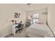 Bright bedroom with desk, white walls, carpet and cute decor at 4528 Craigmoss Ln, Charlotte, NC 28278