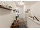 Hallway with decorative shelves and wall hangings leading to carpeted bedrooms at 4528 Craigmoss Ln, Charlotte, NC 28278