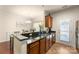 Spacious kitchen featuring granite countertops, stainless steel appliances, and tile flooring at 4528 Craigmoss Ln, Charlotte, NC 28278