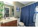 Bathroom with a single sink, a vanity, a shower, and a decorative shower curtain at 4924 Riverdale Dr, Charlotte, NC 28273