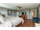 Spacious bedroom with TV, lots of windows and ample storage space at 4924 Riverdale Dr, Charlotte, NC 28273