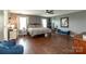 Well-lit bedroom with dark wood floors, lots of windows, and ample space at 4924 Riverdale Dr, Charlotte, NC 28273