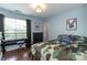 Youthful bedroom featuring sports themed decorations, a piano, and natural light at 4924 Riverdale Dr, Charlotte, NC 28273