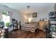 Bedroom featuring laminate floors, a ceiling fan, and lots of natural light at 4924 Riverdale Dr, Charlotte, NC 28273