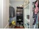 Walk-in closet with shelving units, laminate floors and ample storage space at 4924 Riverdale Dr, Charlotte, NC 28273