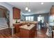 Modern kitchen with granite countertops, stainless steel appliances, and an island, designed for culinary enthusiasts and entertaining at 4924 Riverdale Dr, Charlotte, NC 28273