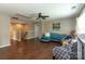 Upstairs living room with hardwood floors, cozy seating, and a ceiling fan at 4924 Riverdale Dr, Charlotte, NC 28273