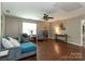 Spacious living room with lots of natural light, hardwood floors and stylish decor at 4924 Riverdale Dr, Charlotte, NC 28273