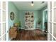 Bright office space with French doors, featuring built-in shelving, and a calming ambiance for productivity and focus at 4924 Riverdale Dr, Charlotte, NC 28273