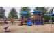 Community playground with blue umbrellas, slides, and climbing structures at 4924 Riverdale Dr, Charlotte, NC 28273