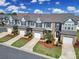 Aerial shot of a row of townhomes, showing driveways and landscaped yards at 526 Hunters Dance Rd, Fort Mill, SC 29708