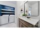 An open view of the bathroom featuring the vanity, mirror, and laundry area at 526 Hunters Dance Rd, Fort Mill, SC 29708