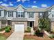 Charming townhome with a one-car garage and beautifully landscaped front yard at 526 Hunters Dance Rd, Fort Mill, SC 29708