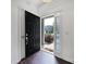 Inviting entryway with a black front door and sidelight with custom shutters at 526 Hunters Dance Rd, Fort Mill, SC 29708