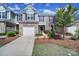 Inviting townhome with a one-car garage and beautiful landscaping, enhancing curb appeal at 526 Hunters Dance Rd, Fort Mill, SC 29708