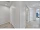 A bright hallway leading to several rooms, showcasing a clean and open layout at 526 Hunters Dance Rd, Fort Mill, SC 29708
