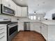 Bright kitchen featuring stainless appliances and white cabinets at 526 Hunters Dance Rd, Fort Mill, SC 29708