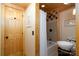 Rustic bathroom features a tiled shower/tub combo and charming vessel sink at 528 Manchester Rd, Mount Gilead, NC 27306
