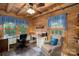 Charming home office with multiple desks, wood ceiling, and natural lighting through the windows at 528 Manchester Rd, Mount Gilead, NC 27306
