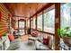Comfortable screened-in porch features cozy seating and a view of the surrounding nature at 528 Manchester Rd, Mount Gilead, NC 27306