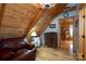 Cozy sitting area featuring a comfortable leather chair and rustic decor in a well-lit space at 528 Manchester Rd, Mount Gilead, NC 27306