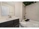 Bathroom with tiled shower and tub, plus a modern vanity with ample storage space at 532 Billingsley Rd, Charlotte, NC 28211