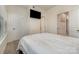 Bright bedroom featuring neutral walls, carpet, television and ensuite bathroom access at 532 Billingsley Rd, Charlotte, NC 28211