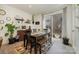 Bright dining room featuring stylish decor, a modern table set, and sliding glass doors to a balcony at 532 Billingsley Rd, Charlotte, NC 28211