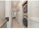 Hallway with stacked washer and dryer and a bedroom view at 532 Billingsley Rd, Charlotte, NC 28211