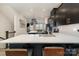 Open-concept kitchen with a large island, modern countertops, and view into the living area at 532 Billingsley Rd, Charlotte, NC 28211