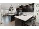 Stylish kitchen featuring a breakfast bar, stainless steel appliances, and an open layout at 532 Billingsley Rd, Charlotte, NC 28211