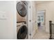 Laundry room with stacked washer and dryer set, next to bedroom at 532 Billingsley Rd, Charlotte, NC 28211