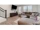 Spacious living room with wood floors, a large sectional sofa, and lots of natural light at 532 Billingsley Rd, Charlotte, NC 28211