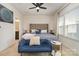 A serene main bedroom boasts a cozy sitting area, elegant furnishings, and abundant light through large windows at 532 Billingsley Rd, Charlotte, NC 28211