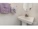 Modern powder room features a sleek pedestal sink, stylish mirror, and attractive decor, great for guests at 532 Billingsley Rd, Charlotte, NC 28211