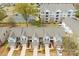Aerial view showcases townhome exteriors, well-manicured landscaping, and convenient parking near community buildings at 5924 Carrollton Ln, Charlotte, NC 28210