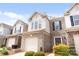 Charming townhome with a one-car garage, brick accents, and meticulously maintained landscaping in a desirable community at 5924 Carrollton Ln, Charlotte, NC 28210