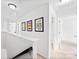 Upstairs hallway features clean lines, neutral colors, and access to multiple rooms at 5924 Carrollton Ln, Charlotte, NC 28210