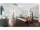 Bright living room with hardwood floors, staircase, neutral walls, and front entrance at 5924 Carrollton Ln, Charlotte, NC 28210