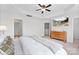 Main bedroom with en-suite bathroom and TV mounted on the wall at 5924 Carrollton Ln, Charlotte, NC 28210