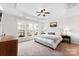 Serene main bedroom with tray ceilings, natural light, and tasteful decor at 5924 Carrollton Ln, Charlotte, NC 28210