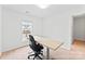 Bright office featuring a functional desk and chair, creating an ideal workspace at 5924 Carrollton Ln, Charlotte, NC 28210