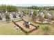 Community aerial view showcasing a playground with slides, picnic tables and green spaces for outdoor enjoyment at 5924 Carrollton Ln, Charlotte, NC 28210