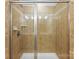 Glass-enclosed shower with tiled walls, offering a luxurious and modern bathing experience at 5924 Carrollton Ln, Charlotte, NC 28210