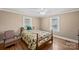 Cozy bedroom with hardwood floors and natural light from two windows at 61 Brown Sw St, Concord, NC 28027
