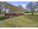 Charming home featuring a welcoming front porch and well-maintained lawn at 61 Brown Sw St, Concord, NC 28027