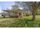 Charming single-story home with a cozy front porch and well-maintained lawn in a quaint neighborhood at 61 Brown Sw St, Concord, NC 28027