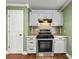 Updated kitchen showcases stainless steel gas range and ample cabinetry at 61 Brown Sw St, Concord, NC 28027