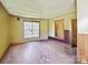 Unfurnished living room features a large window, hardwood floors, and neutral wall paint at 61 Brown Sw St, Concord, NC 28027